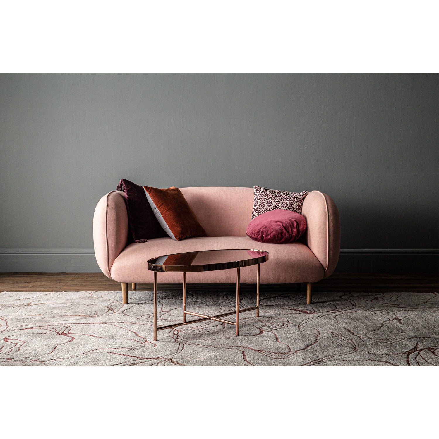 Xander oval coffee table in Copper colour frame with mirror top.